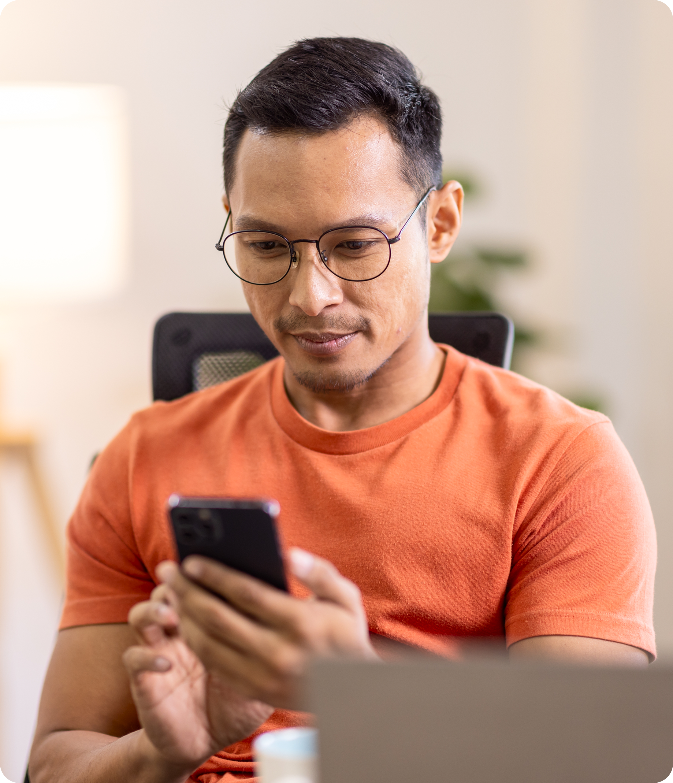 Man using phone for currency exchange